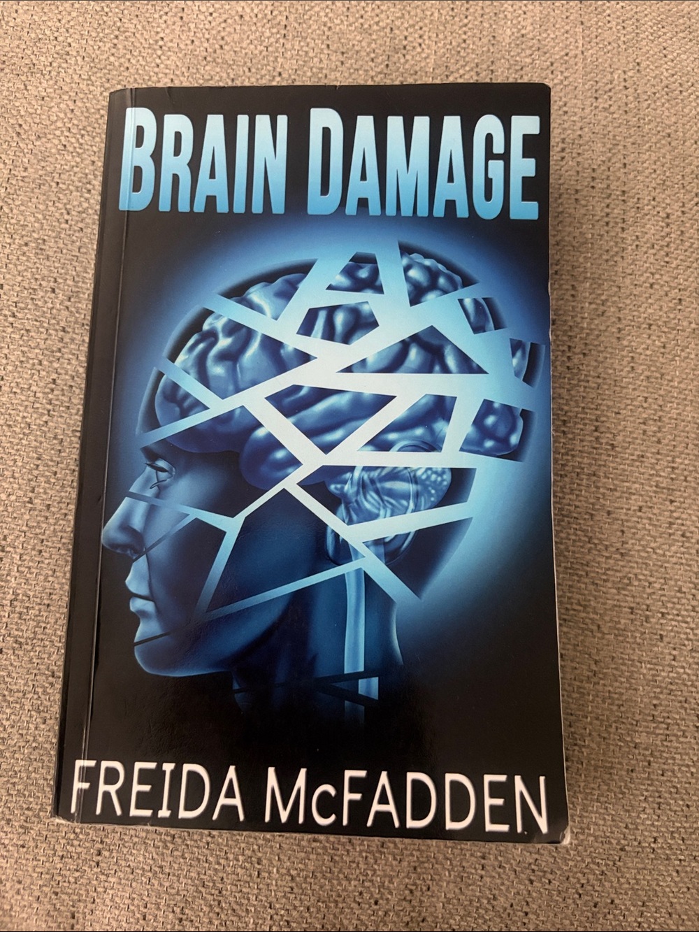 Brain Damage by Freida McFadden - Blue Graphic Cover Paperback